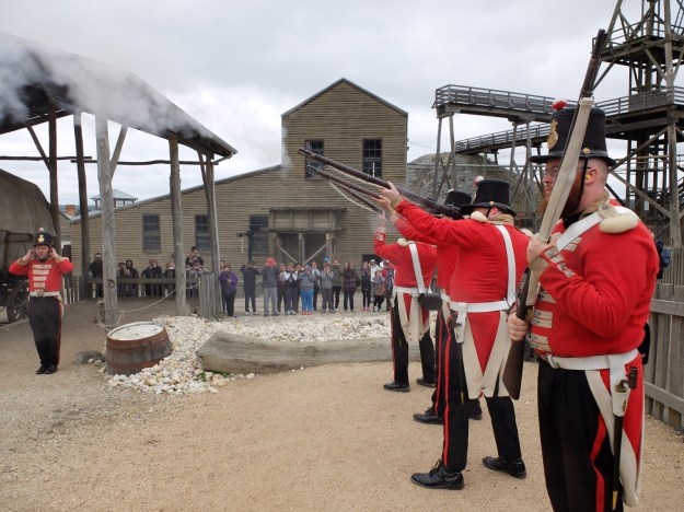 Soldiers on the parade ground, firing live rounds into the air (and ears!)