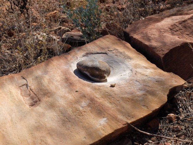 A grinding stone with grinder still in tact - April loved playing with this traditional tool!